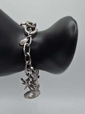 VTG Fossil Charm Bracelet Silver Tone Size 6.25" With 7 Charms Oversized Clasp